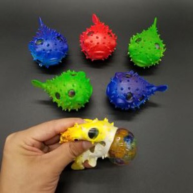 رنگین مچھلی نچوڑ گیند